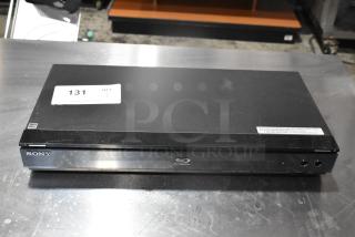 Sony BDP-S560 Blu-ray/DVD player, black, front view, with labels, good condition, used, auction tag visible.