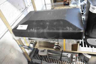 Brand new Hongtaok K23B stainless steel countertop gas griddle, 21,000 BTU, with minor scratches, item tag 142 visible.