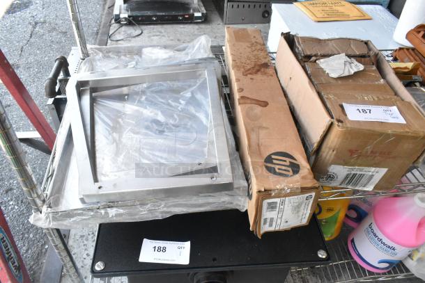 Tier lot of items including HP Bright White Inkjet Paper box, UPR6GE plates, and metal pieces on shelving. Some boxes show wear.