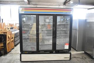 True GDM-72F Metal Commercial 3 Door Reach In Freezer Merchandiser w/ Poly Coated Racks. 115/208-230 Volts, 1 Phase. - Item #1193374