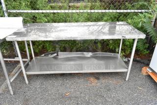 Stainless steel table with under shelf, scratch and dent condition, brand new. Ideal for kitchens or workshops.
