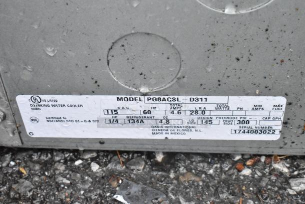 Metal wall mount water fountain label showing model PG8AGSL-D311, 115VAC, refrigerant R134A, serial number 1744003022.