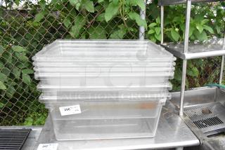 Lot of 6 clear poly bins, stackable, used condition, with a visible tag labeled "296 QTY 1 VXL".
