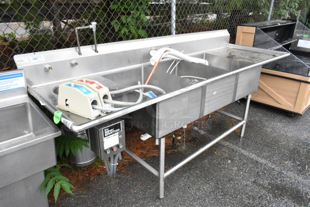 Winholt stainless steel 3 bay sink with dual drain boards and Insinkerator garbage disposal. Good condition, commercial use.