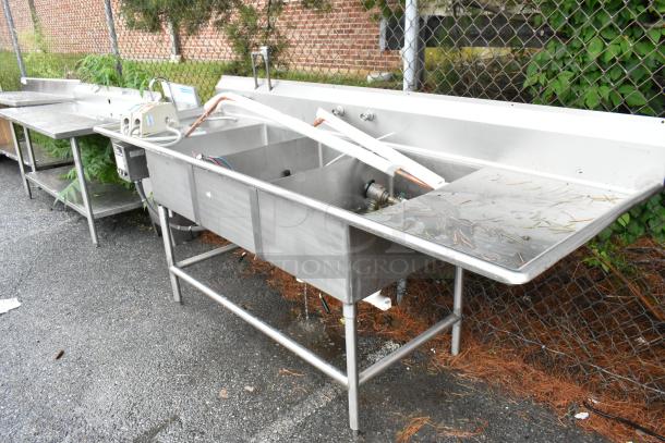 Winholt stainless steel commercial 3-bay sink with dual drain boards and Insinkerator disposal, moderate wear.