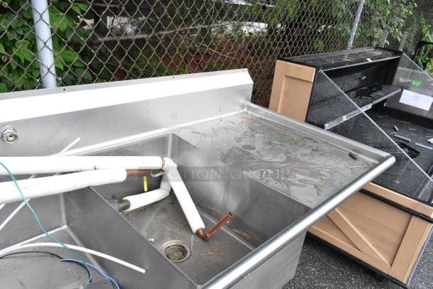 Winholt stainless steel 3 bay sink with dual drain boards, includes Insinkerator garbage disposal, visible wear.