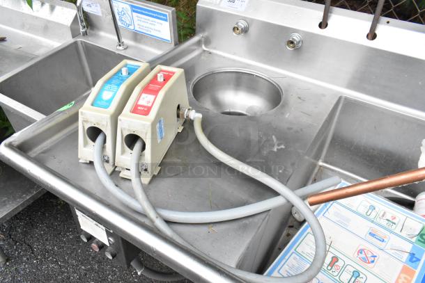 Winholt stainless steel 3 bay sink with dual drain boards and Insinkerator garbage disposal; commercial use, good condition.