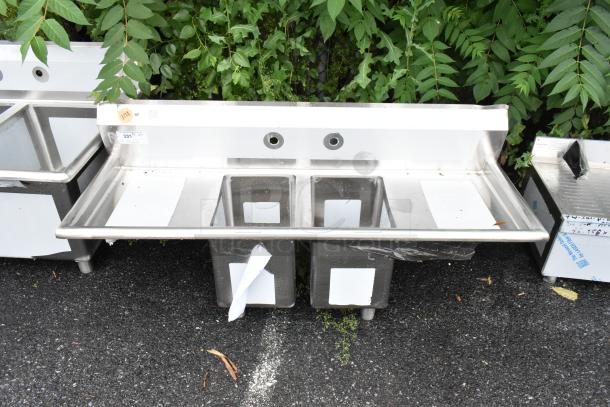 BRAND NEW SCRATCH AND DENT! Regency 600S21014216 16-Gauge Stainless Steel Two Compartment Commercial Sink with Galvanized Steel Legs and Two Drainboards - Image 1 of 9