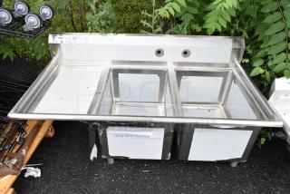 BRAND NEW SCRATCH AND DENT! Regency 600S2182418L Stainless Steel 2 Bay Sink w/ Left Side Drain Board. No Legs. - Item #1193450