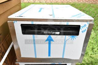 Brand new scratch and dent stainless steel drawer, protective covering shows minimal marks, ready for installation.