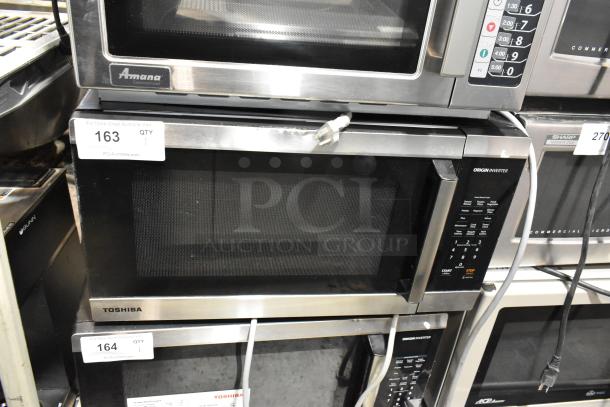 Toshiba metal countertop microwave oven with plate, 120 volts, 1 phase, in good condition, with visible control panel.