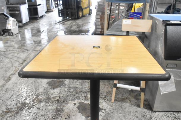 Three bar height tables with metal base, wood top 38x30x42 inches, black edge. Includes three tables.