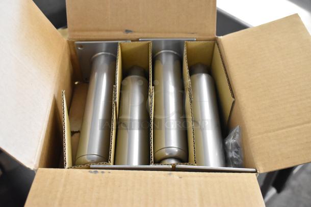 Cardboard box with four stainless steel tubes, likely components for assembly of the 2025 Pitco Frialator SG18 fryer.
