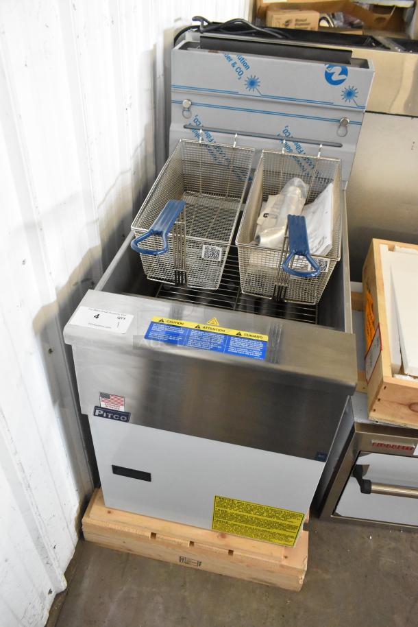 Brand new Pitco Frialator SG18 fryer, 75 lb capacity, 140,000 BTU, stainless steel, two metal fry baskets, natural gas-powered.