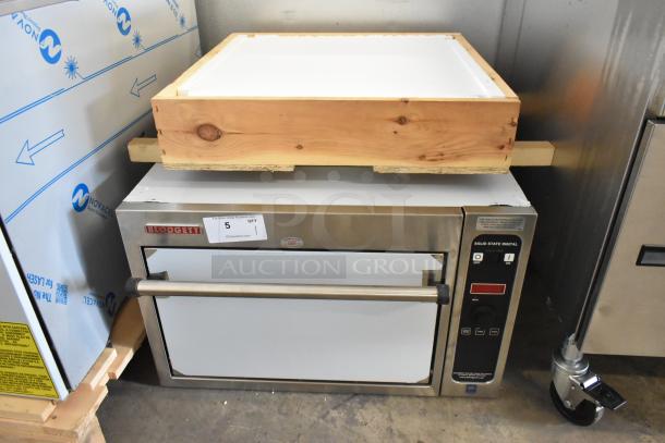 BRAND NEW Blodgett 1415 stainless steel commercial countertop oven, 208V, 3-phase, with minor scratches and dents.