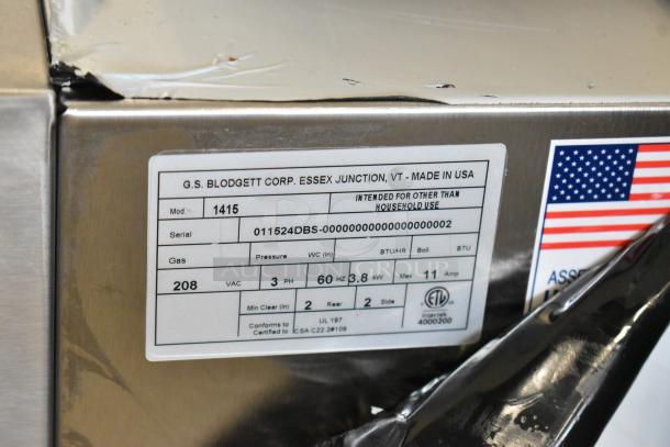 Stainless steel tag on Blodgett 1415 oven indicating model, serial number, 208V, 3-phase power, and UL certification.
