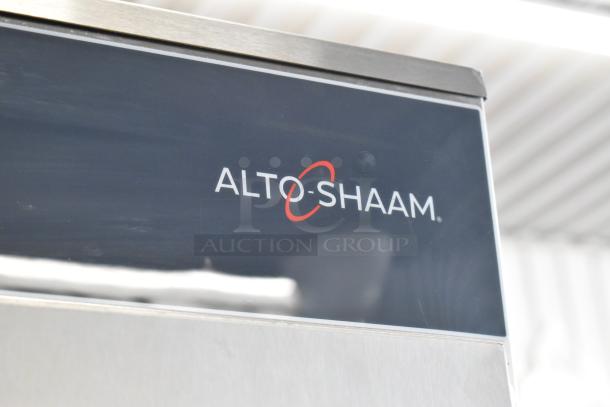 Brand new Alto Shaam 1200-UP stainless steel holding cabinet with universal racks, Dutch door, and commercial casters.