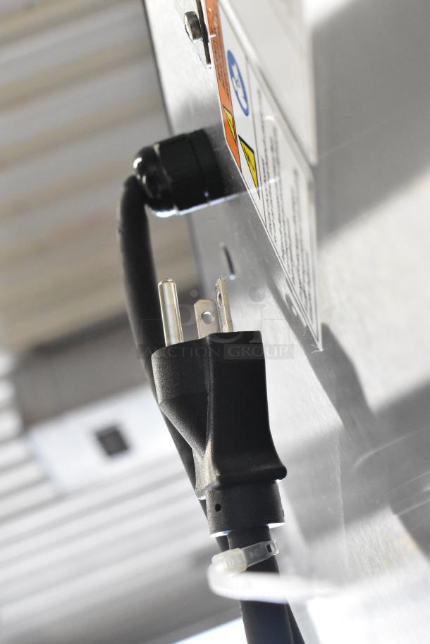 Power cord and plug of Alto Shaam 1200-UP stainless steel holding cabinet, showing electrical specifications and connectors.