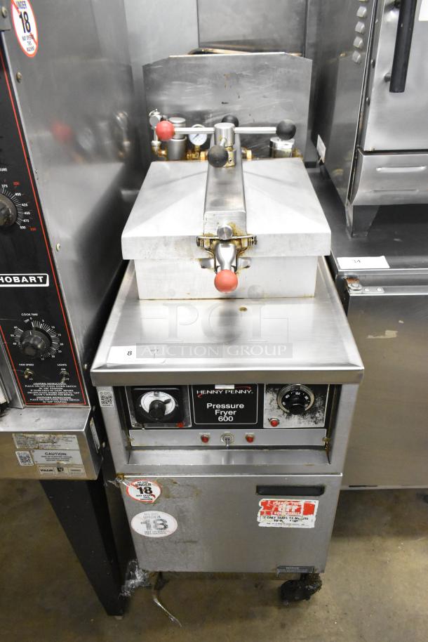 Henny Penny 600 stainless steel pressure fryer, natural gas, 80,000 BTU, on casters. Visible controls, labels; used condition.