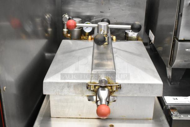 Henny Penny 600 stainless steel pressure fryer, natural gas, on casters, 80,000 BTU. Commercial-grade, used condition.
