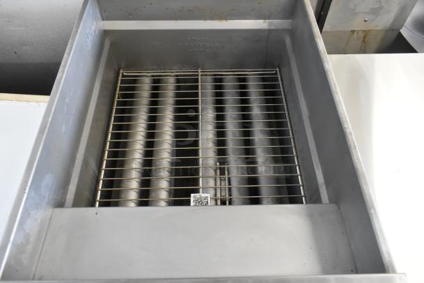 New 2023 Pitco Frialator SG18 propane fryer, stainless steel, 140,000 BTU, on casters. Interior view with heating tubes.