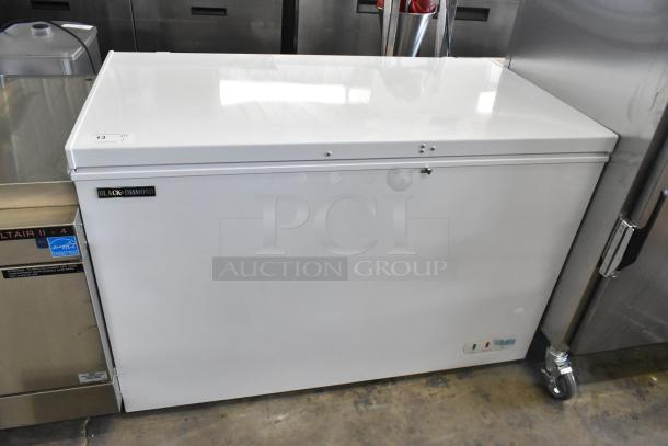 Black Diamond BDCF-13R metal chest freezer with hinge lid, 115 volts, 1 phase. Features a sleek design in good condition.