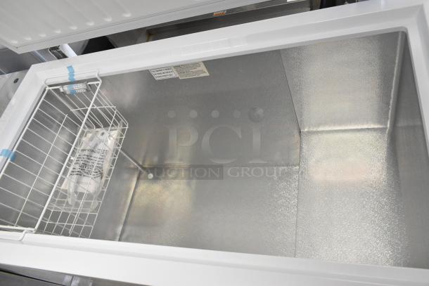 Black Diamond BDCF-13R chest freezer with hinge lid, metal interior, 115 volts, 1 phase, includes storage basket and safety labels.
