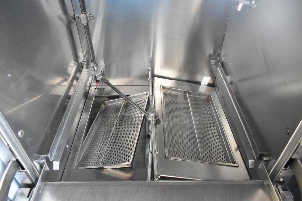 Brand new 2024 Noble Wareforce UH30-E stainless steel commercial undercounter dishwasher, showing interior details.