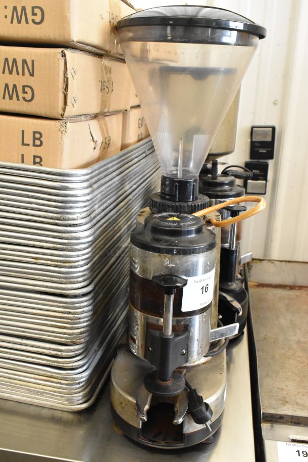 Metal commercial countertop espresso bean grinder, 115 volts, 1 phase, with clear hopper. Used condition. Electric plug visible.