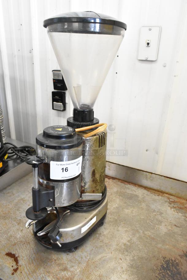 Metal commercial countertop espresso bean grinder, worn condition. Features a clear hopper, 115 volts, 1 phase. Auction tag visible.