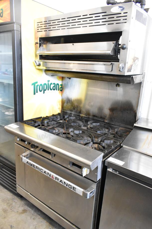 American Range stainless steel 6-burner gas range with salamander cheese melter, backsplash, and oven. Good condition.