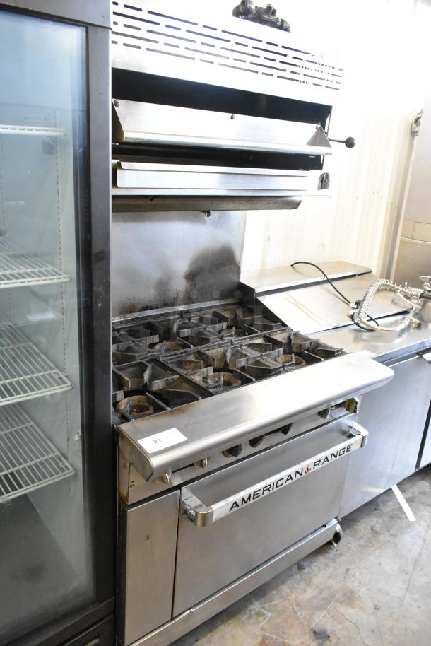 American Range stainless steel commercial gas 6-burner range with salamander cheese melter, backsplash, and oven.