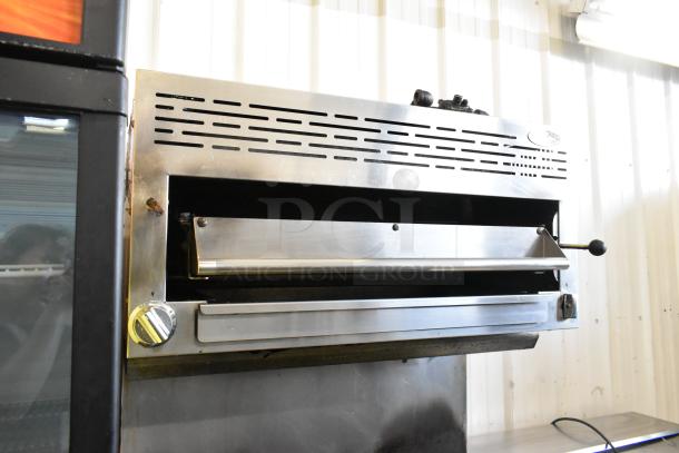 American Range stainless steel gas-powered 6 burner range with salamander cheese melter, backsplash, and oven.