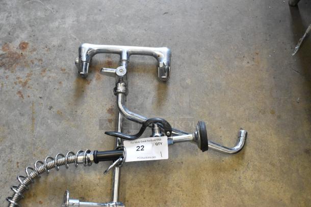 Industrial spray nozzle attachment with faucet, chrome finish, coiled hose, and lever handle. Auction label reads "22 QTY."