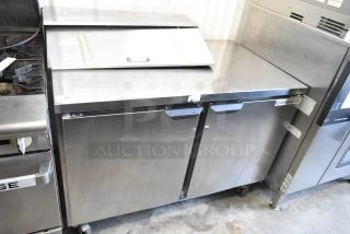 Beverage Air SPE48HC-08 stainless steel prep table with bain marie top, commercial casters, 115V, 1-phase, used condition.