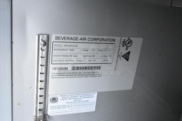 Beverage Air SPE48HC-08 stainless steel commercial prep table. 115V, 1 phase. Label shows model and electrical specs.