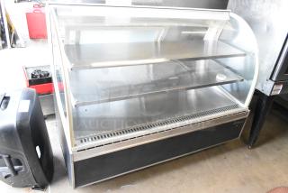 Turbo Air TD-5R metal commercial deli display case, 115 Volts, 1 Phase, two shelves, curved glass front, good condition.