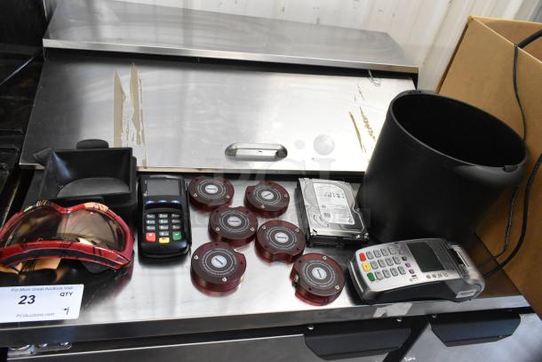 Lot of items including 2 credit card readers, 6 wireless call system discs, one hard drive, and more, various conditions.