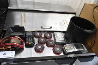 Lot of items including 2 credit card readers, 6 wireless call system discs, one hard drive, and more, various conditions.