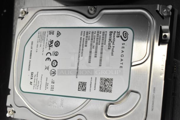 Seagate 3TB Barracuda hard drive, recertified, label displays model/serial numbers and QR code.