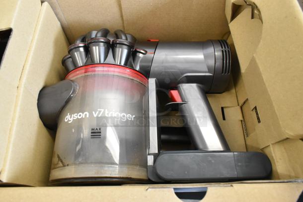 Dyson V7 Car and Boat Hand Vacuum in original box, features include "max" label on dustbin, excellent condition.
