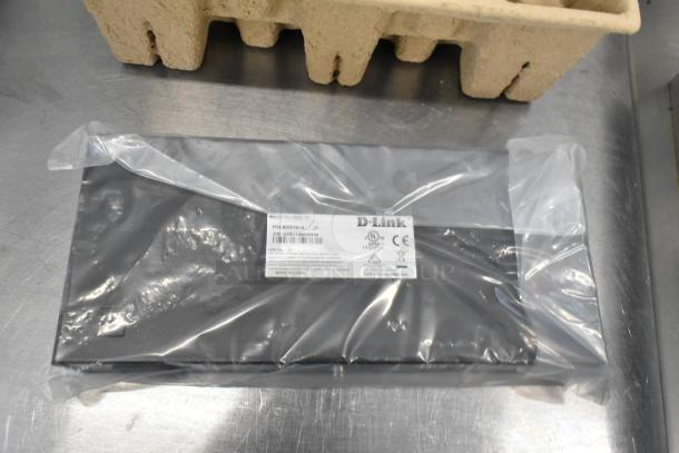 IN ORIGINAL BOX! D-Link desktop or rackmount switch, model DGS-16; sealed in plastic.