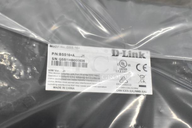 IN ORIGINAL BOX! D-Link desktop or rackmount switch, Model DSS-16+, new in packaging. Visible label with model, P/N, S/N, and certifications.