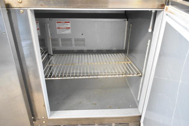 Beverage Air UCR48AHC 2-door stainless steel undercounter cooler, commercial casters, 115V, interior shelves, used condition.