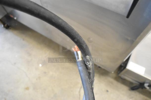 Close-up of exposed wires on a Dalla Corte espresso machine, highlighting potential repair needs.