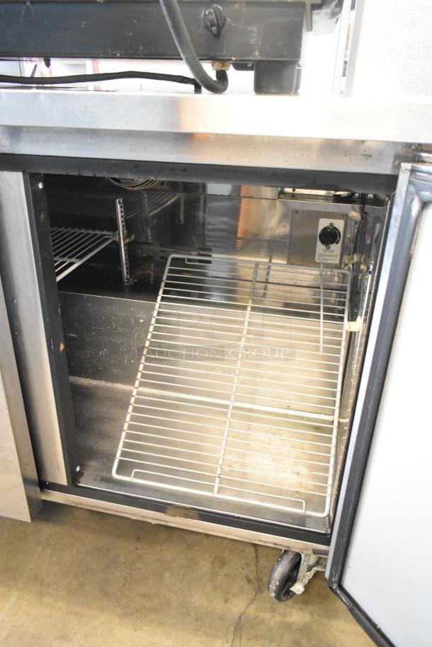 Turbo Air MUR-48 stainless steel 2-door undercounter cooler, on casters, 115V, 1 phase, interior view showing shelves.