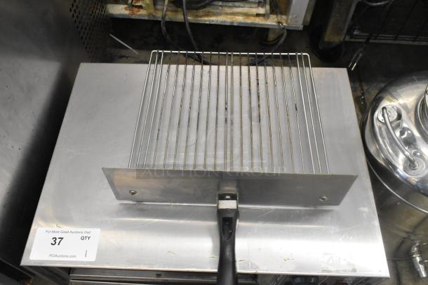 2022 Benchmark USA 54012 stainless steel commercial pizza oven, electric, 120V, good condition, auction tag visible.