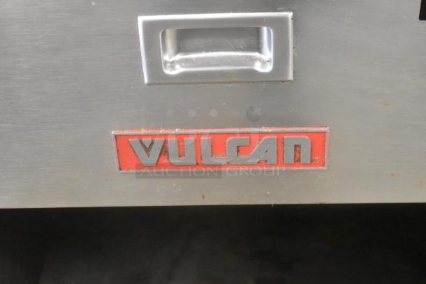 Vulcan stainless steel commercial braising pan on casters, floor style, includes red Vulcan logo, industrial-grade condition.