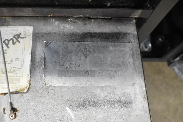 Vulcan stainless steel commercial braising pan on casters, visible wear. Marking plate with engraved specifications.