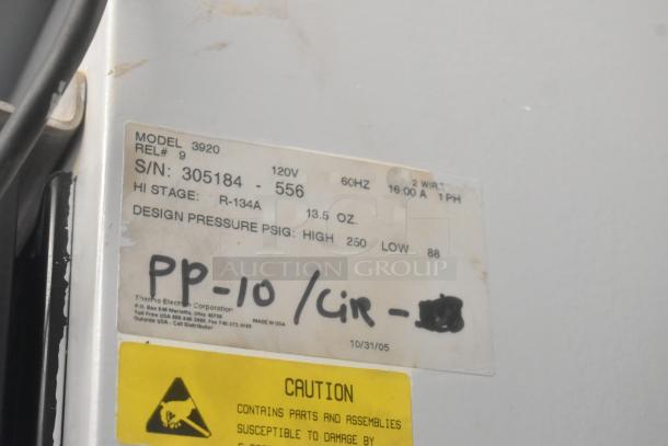 Thermo 3920 single door incubator label showing model, serial number, voltage, and cautionary information.